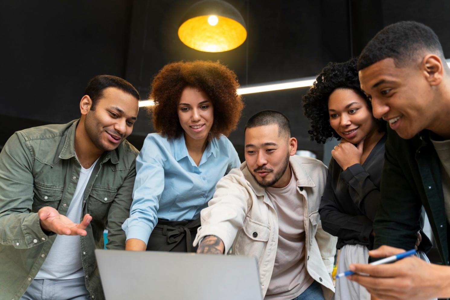 Student working on mobile game interface design in classroom setting